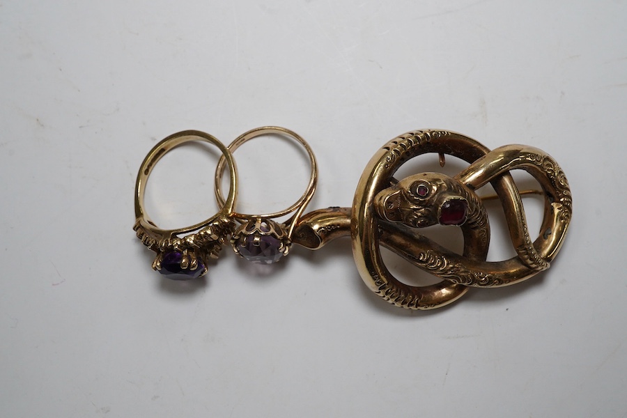 A Victorian yellow metal and gem set coiled serpent brooch, 47mm, together with two 1960's 9ct gold and gem set rings, gross weight 12.5 grams. Condition - poor to fair